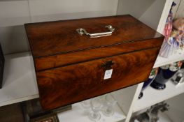 A good 19th century mahogany tea caddy with silver handle and mounts, the interior with two