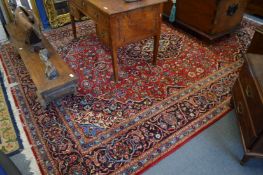 A good large Persian design carpet, red ground with stylised decoration, 385cm x 270cm.