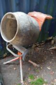 A Belle Minimix 150 110 volt cement mixer with transformer and stand.