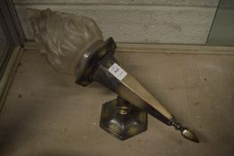 A flaming torch style wall light.