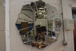 Decorative modern sunburst style mirror.