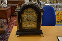 A good Victorian ebonised break arched bracket/table clock with brass fittings and reeded columns,