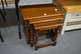 A nest of oak tables.