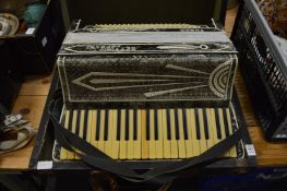 A cased accordion.