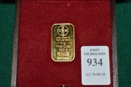 A 10 gram ingot of fine gold marked 999.9, boxed with certificate.