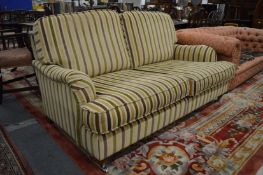 A good modern two seater settee upholstered with a striped material.