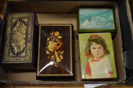 Three musical boxes and a Japanese lacquer box.
