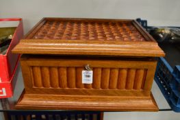 A humidor containing quantity of cigars.
