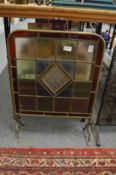 Brass and stained glass fire screen.