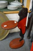 An amusing painted wooden waiter modelled as a doggy.