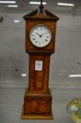 A miniature walnut long case clock.