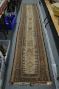An unusual Middle Eastern runner decorated with camels and birds, 390cm x 76cm.