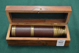 A cased telescope.