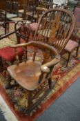 A 19th century broad arm Windsor rocking chair.