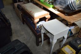 A bedside table and two stools.