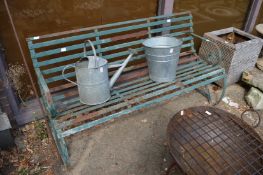 A good green painted wrought iron garden bench.