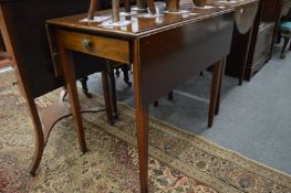 A small mahogany Pembroke table.