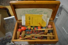 A boxed table croquet set.