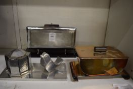 A novelty cigarette dispenser and other items.