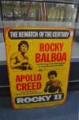 A reproduction metal sign advertising Rocky II.