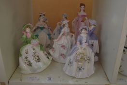 A group of eight Royal Worcester figurines of ladies.