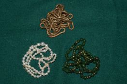 A group of decorative bead and other necklaces.