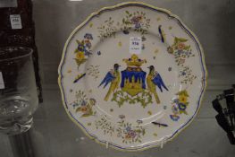 A Continental faience armorial dish.