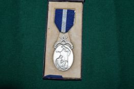 A boxed medal.