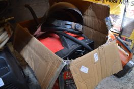 A welder with accessories.