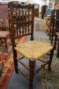 A set of four Lancashire spindle back dining chairs.