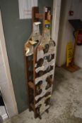 A bottle shaped wooden wine rack.