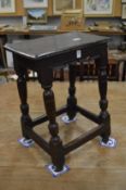 A 17th century oak joint stool.