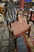A set of eight Hepplewhite style mahogany dining chairs, two with arms, all with carved Prince of