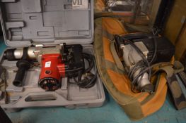 Two mains powered SDS drills.