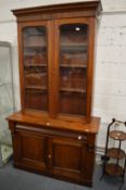 A Victorian mahogany cupboard bookcase.