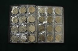 A collection of various Commemorative 50p pieces.