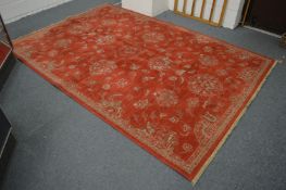 A modern red ground rug, 300cm x 200cm.