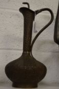A good Islamic ewer with chased decoration.