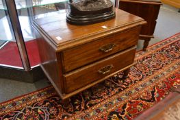 A pair of hardwood two drawer bedside chests.