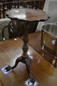 A good pair of reproduction small carved mahogany wine tables.