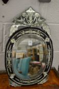 A small Venetian style dressing table or strut mirror.