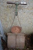 A cast iron garden roller.