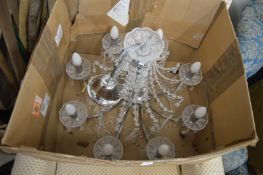 A chrome plated and cut glass chandelier.