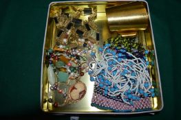 A stylish cuff bangle, decorative necklaces etc.