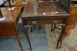 A mahogany envelope card table.