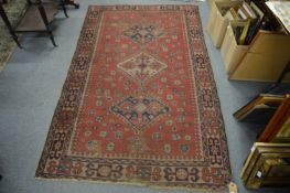 A Persian design rug with three central large medallions, 210cm x 125cm