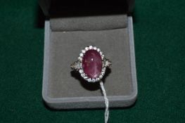 A natural 6ct cabochon ruby and sterling silver ring with certificate.