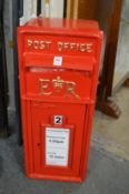 A reproduction cast iron postbox.