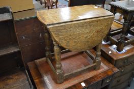Small oak drop-leaf table and two oak joint stools.