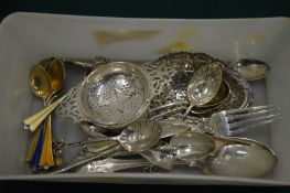 A group of small silverware.